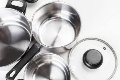 stainless-steel-pots-pans-isolated-white_93675-40412